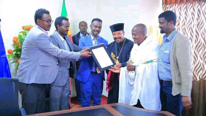 Certificates Being handed over to representatives of the Orthodox Church