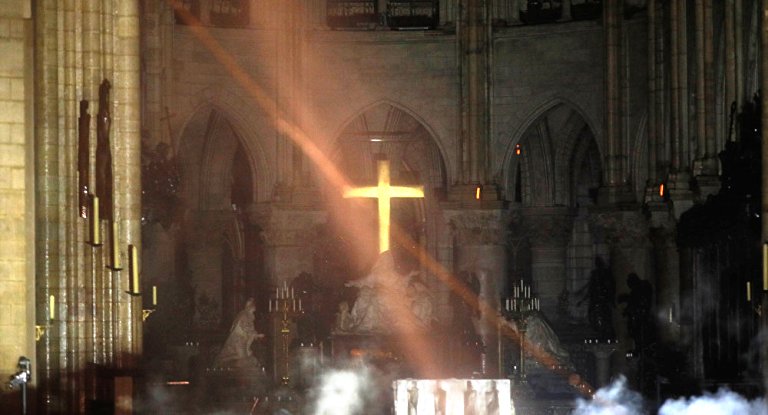 Notre Dame’s Interior Ravaged by Flames But Cross Remains Intact