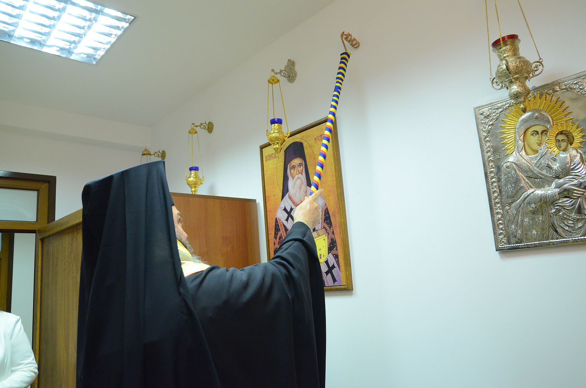 Bishop Ieronim of Sinaia blesses the painting of St Nectarios Palliative Care Centre’s Chapel
