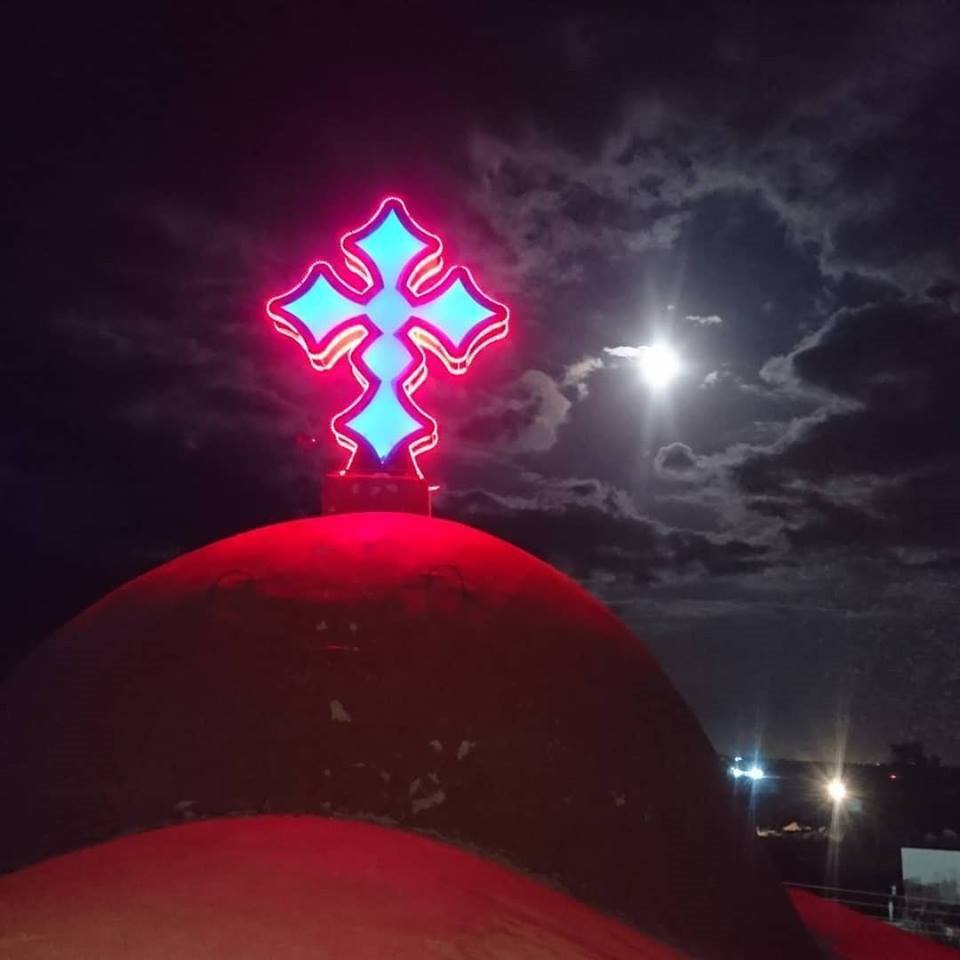 Cross destroyed by ISIS restored on the dome of the ancient St. Morth Shmooni Syriac Orthodox Church in Iraq